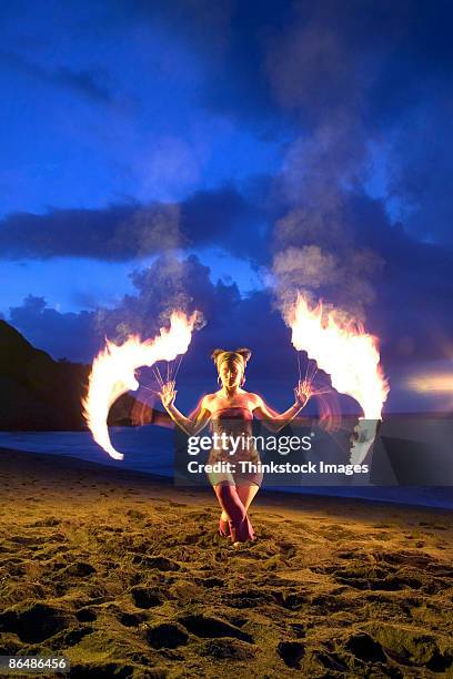 woman twirling fire - fire performer stock pictures, royalty-free photos & images