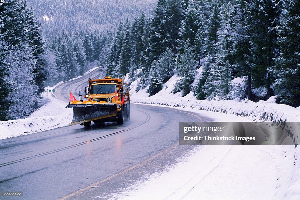 Snowplow on winter road