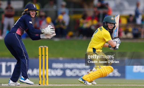 Australia's Alex Blackwell plays a shot as Sarah Taylor looks on during the Women's One Day International between Australia and England at Allan...