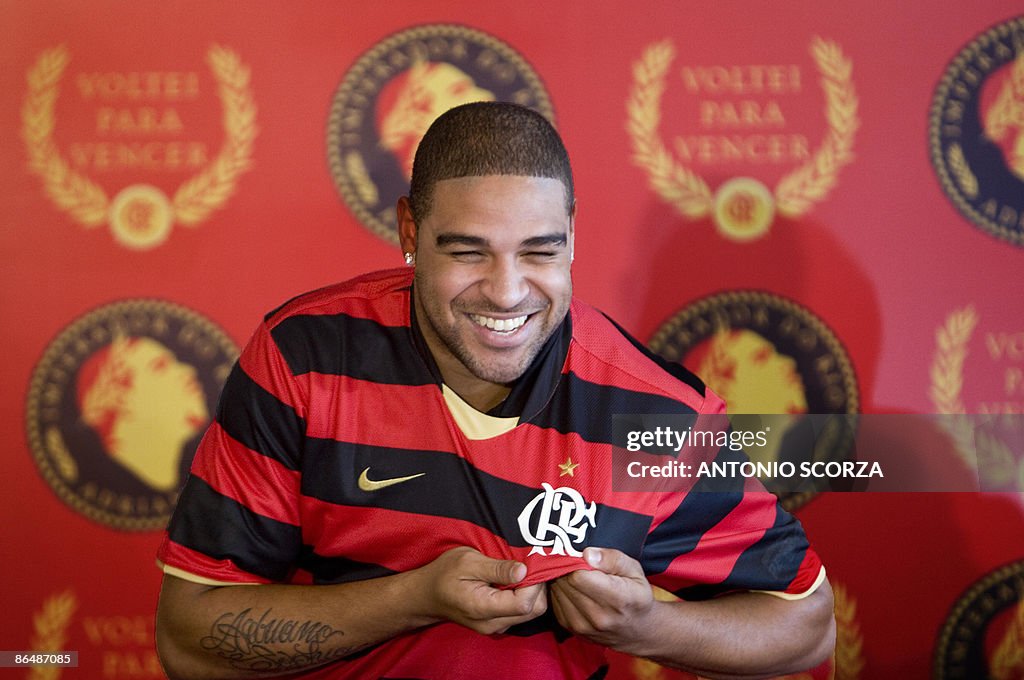 Brazil's forward Adriano holds a Flameng