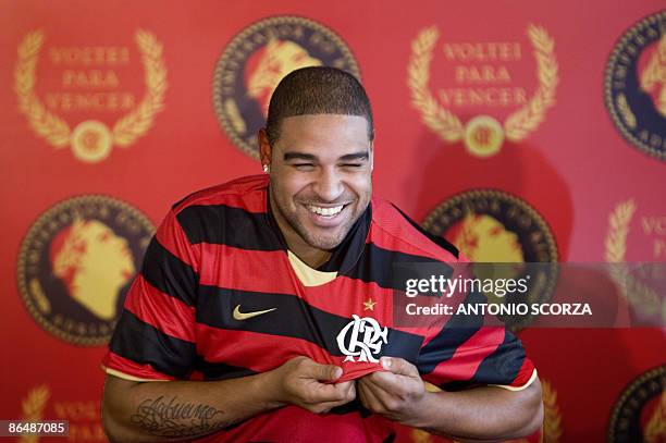 Brazil's forward Adriano holds a Flamengo's jersey on May 7 during his presentation as new player of the Brazilian football team, in Rio de Janeiro....