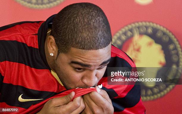 Brazil's forward Adriano kisses a Flamengo's jersey on May 7 during his presentation as new player of the Brazilian football team, in Rio de Janeiro....