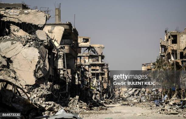 Picture taken on October 21, 2017 shows a general view of heavily damaged buildings in Raqa, after a Kurdish-led force expelled the Islamic State...