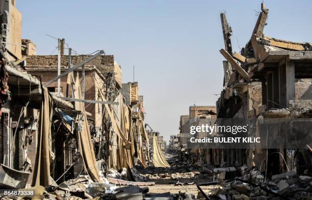 Picture taken on October 21, 2017 shows a general view of heavily damaged buildings in Raqa, after a Kurdish-led force expelled the Islamic State...