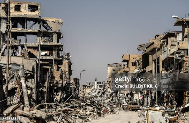 Picture taken on October 21, 2017 shows a general view of heavily damaged buildings in Raqa, after a Kurdish-led force expelled the Islamic State...