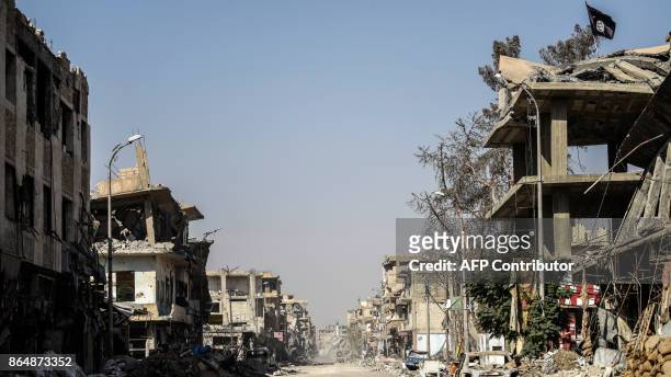 Picture taken on October 21, 2017 shows a general view of heavily damaged buildings in Raqa, after a Kurdish-led force expelled the Islamic State...