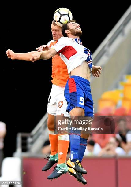 Benjamin Kantarovski of the Jets and Luke DeVere of the Roar challenge for the ball during the round three A-League match between the Brisbane...