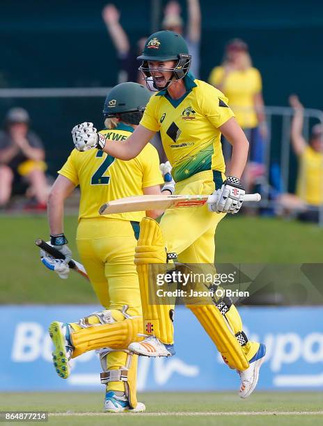 Australia's Alex Blackwell and Jess Jonassen celebrate after victory during the Women's One Day International between Australia and England at Allan...