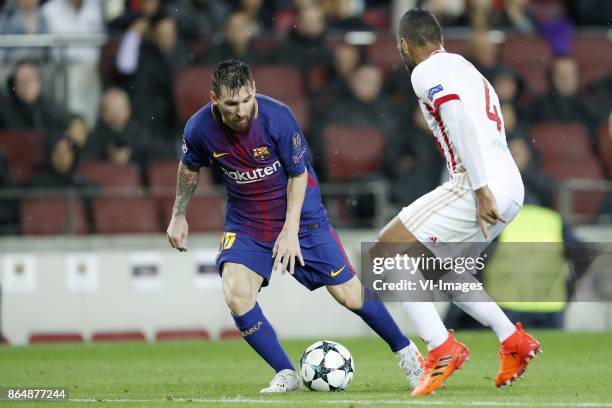 Lionel Messi of FC Barcelona, Alaixys Romao of Olympiacos during the UEFA Champions League group D match between FC Barcelona and Olympiacos on...