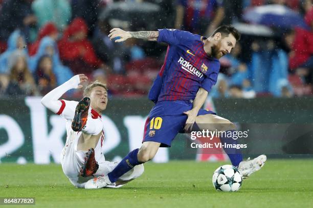 Leonardo Koutris of Olympiacos, Lionel Messi of FC Barcelona during the UEFA Champions League group D match between FC Barcelona and Olympiacos on...