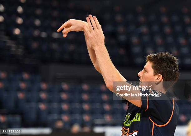 Cam Gliddon of the Taipans warms up before the start of the round three NBL match between the Cairns Taipans and the Perth Wildcats at Cairns...
