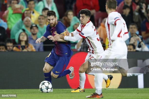 Lionel Messi of FC Barcelona, Thanasis Androutsos of Olympiacos, Leonardo Koutris of Olympiacos during the UEFA Champions League group D match...