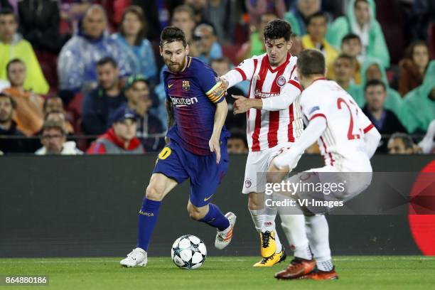 Lionel Messi of FC Barcelona, Thanasis Androutsos of Olympiacos, Leonardo Koutris of Olympiacos during the UEFA Champions League group D match...