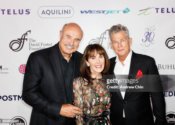 Dr. Phil McGraw, Robin McGraw and David Foster attend the David Foster Foundation Gala at Rogers Arena on October 21, 2017 in Vancouver, Canada.