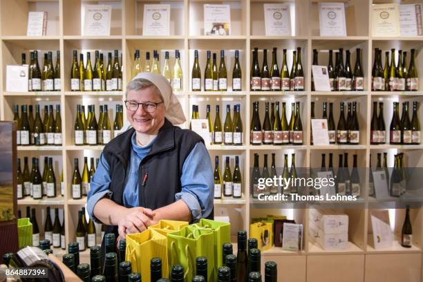 Nun Thekla of St. Hildegard Abbey pictured in the store 'Vinothek' on October 20, 2017 near Rudesheim on the Rhine, Germany. The St. Hildegard winery...