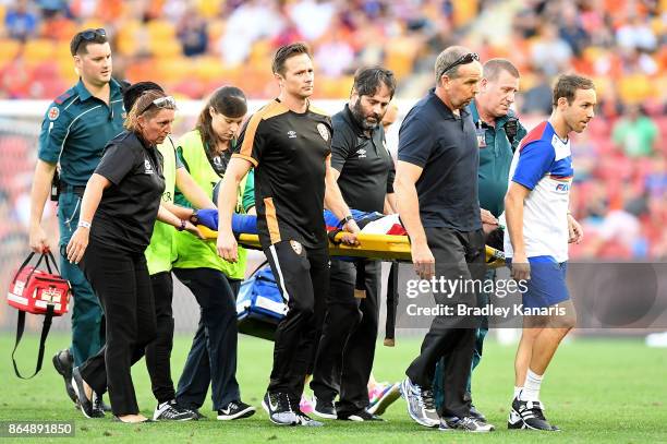 Ronald Vargas of the Jets is taken from the field injured during the round three A-League match between the Brisbane Bullets and the Newcastle Jets...