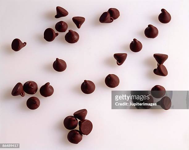 chocolate chips - chocolate chips stock pictures, royalty-free photos & images