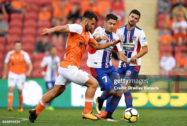 Petros Skapetis of the Roar and Dimitri Petratos of the Jets compete for the ball during the round three A-League match between the Brisbane Bullets...