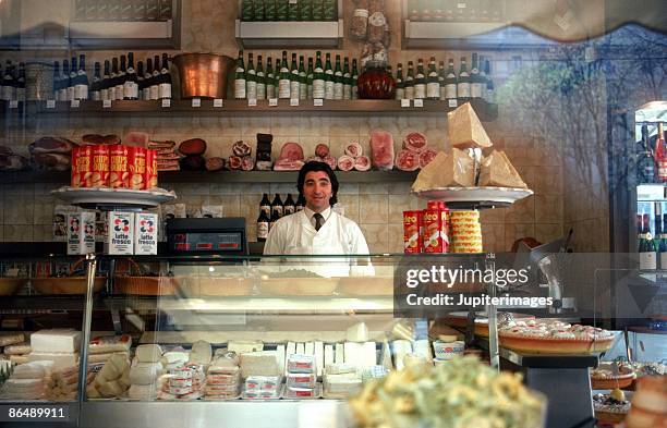 man in european deli - deli counter stock pictures, royalty-free photos & images