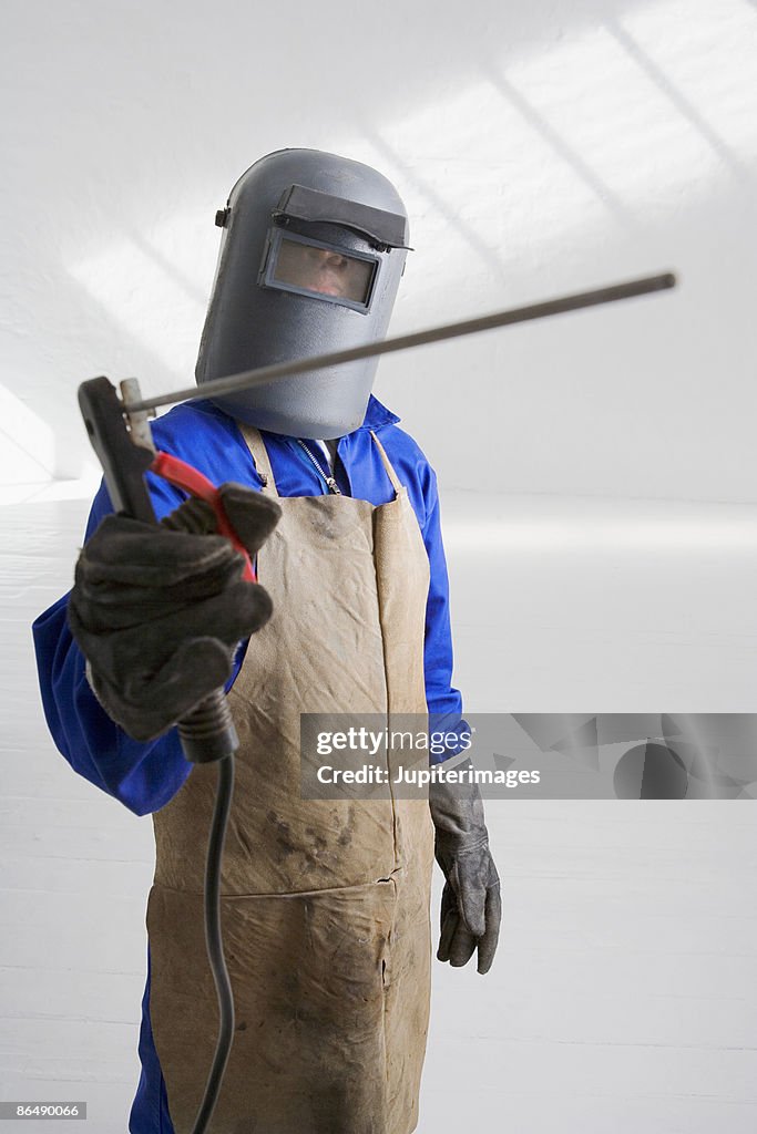 Man in welding mask