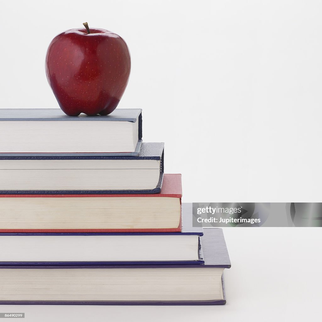 Book Stack With Ruler Apple Apple And Stack Of Books High-Res Stock Photo - Getty Images