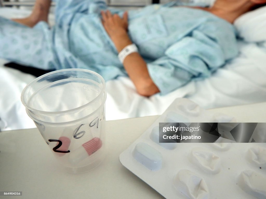 Sick woman receiving medication