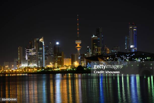 kuwait skyline at night - kuwait landmark stock pictures, royalty-free photos & images