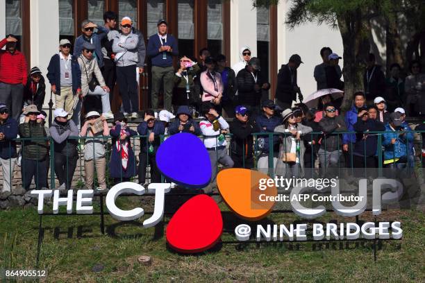 Fans watch at the 18th green during the final round of the CJ Cup at Nine Bridges in Jeju Island on October 22, 2017. / AFP PHOTO / JUNG Yeon-Je