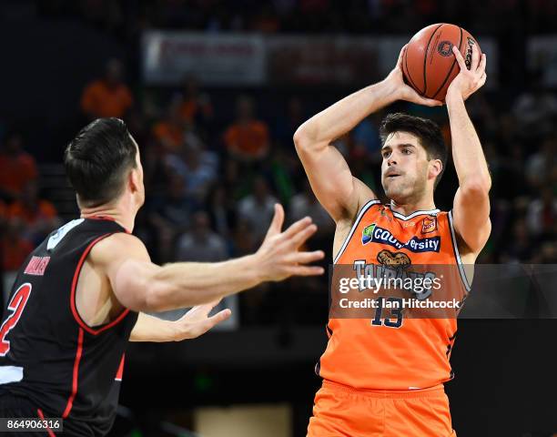 Stephen Weigh of the Taipans looks to get a pass away during the round three NBL match between the Cairns Taipans and the Perth Wildcats at Cairns...