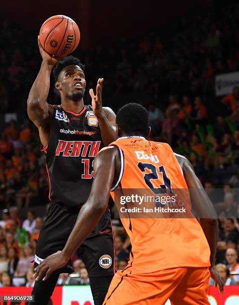 Derek Cooke Jr of the Wildcats takes a shot over Nnanna Egwu of the Taipans during the round three NBL match between the Cairns Taipans and the Perth...