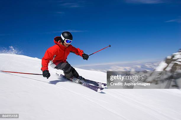 man snow skiing - downhill skiing fotografías e imágenes de stock
