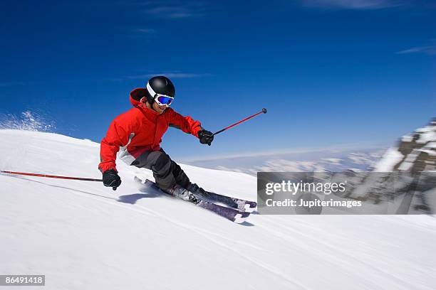 man snow skiing - downhill skiing stock pictures, royalty-free photos & images