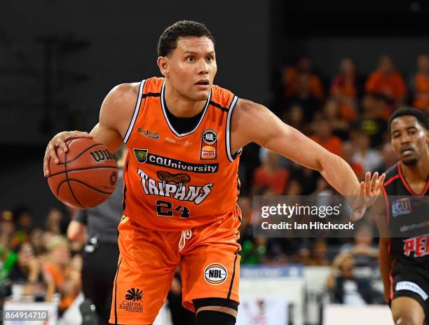 Michael Carrera of the Taipans looks to pass the ball during the round three NBL match between the Cairns Taipans and the Perth Wildcats at Cairns...