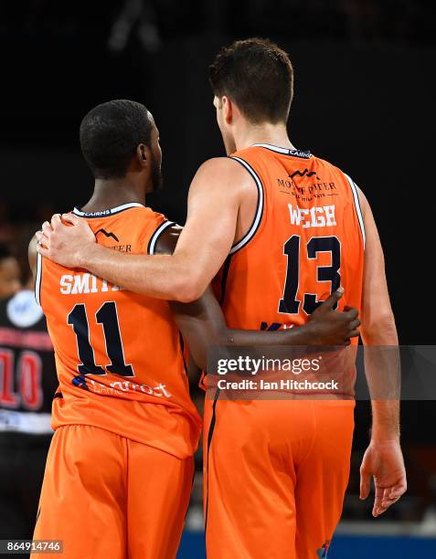 Scoochie Smith and Stephen Weigh of the Taipans share an embrace during the round three NBL match between the Cairns Taipans and the Perth Wildcats...