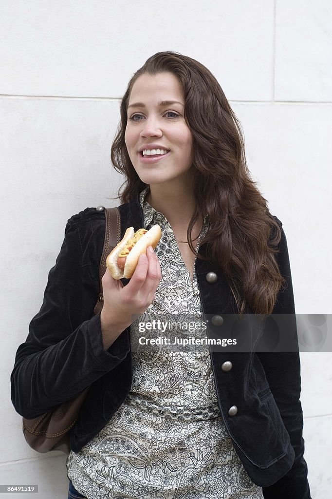 Woman with hot dog