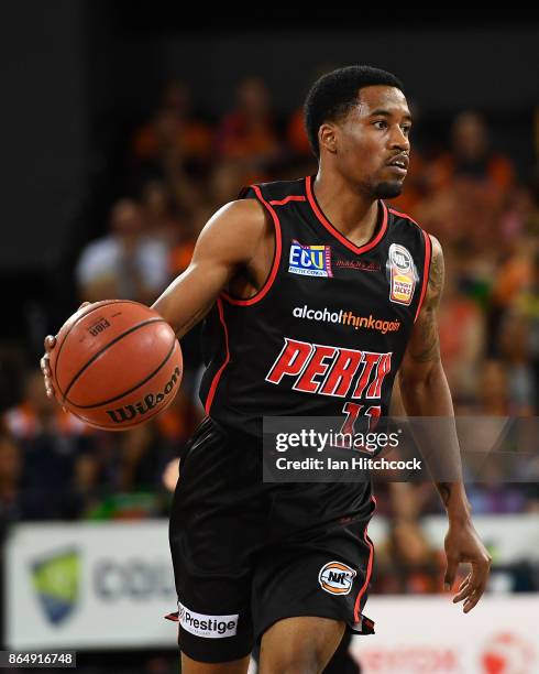 Bryce Cotton of the Wildcats dribbles the ball during the round three NBL match between the Cairns Taipans and the Perth Wildcats at Cairns...