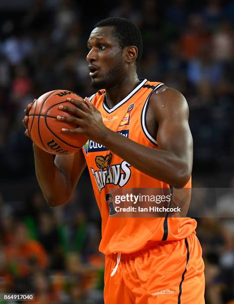 Nnanna Egwu of the Taipans looks to pass the ball during the round three NBL match between the Cairns Taipans and the Perth Wildcats at Cairns...