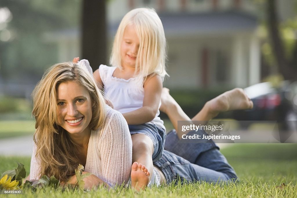 Mother and daughter in lawn