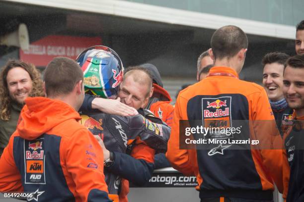 Brad Binder of South Africa and Red Bull KTM Ajo celebrates with his team under the podium at the end of the Moto2 race during the 2017 MotoGP of...