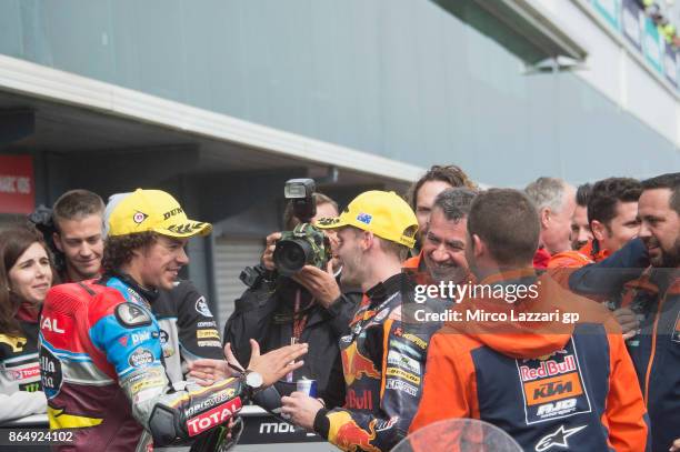 Franco Morbidelli of Italy and EG 00 Marc VDS and Brad Binder of South Africa and Red Bull KTM Ajo celebrate under the podium at the end of the Moto2...