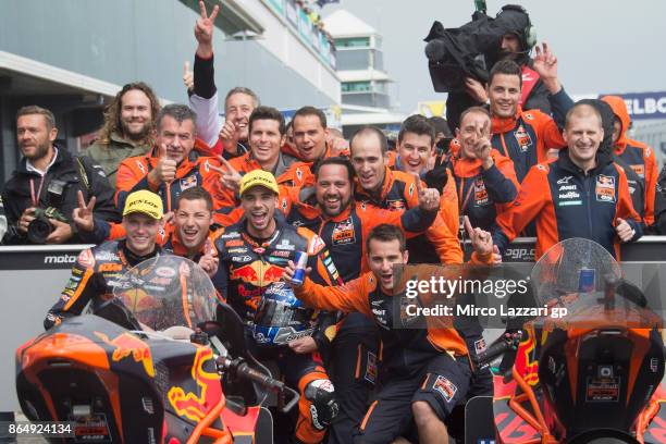 Brad Binder of South Africa and Red Bull KTM Ajo and Miguel Oliveira of Portugal and Red Bull KTM Ajo celebrates under the podium at the end of the...