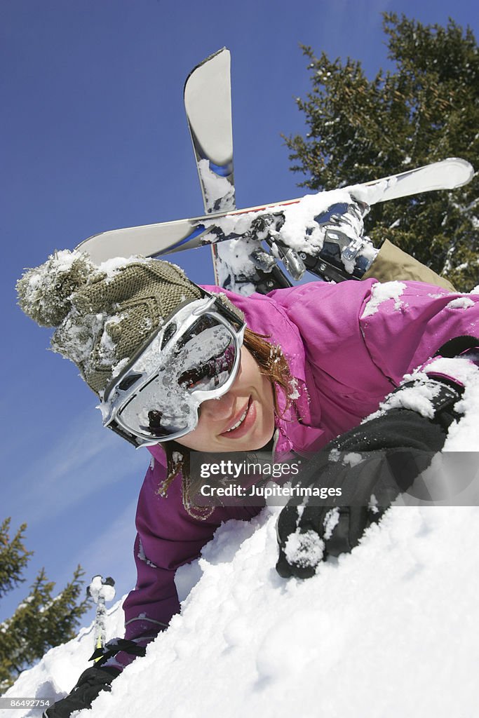 Woman lying down in snow