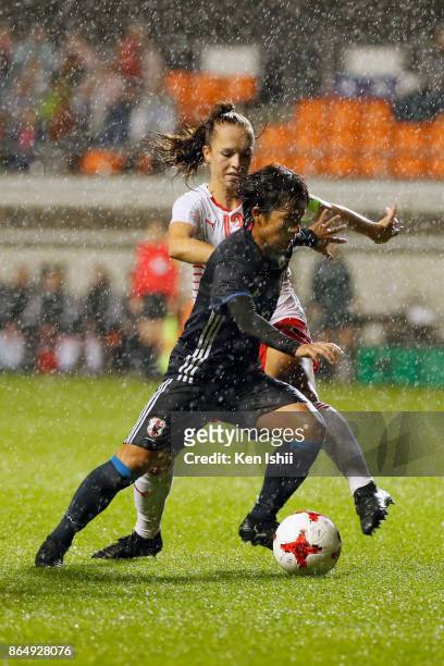 Mana Iwabuchi of Japan and Lia Walti of Switzerland compete for the ball during the international friendly match between Japan and Switzerland at...