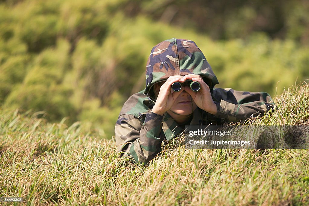 Soldier using binoculars