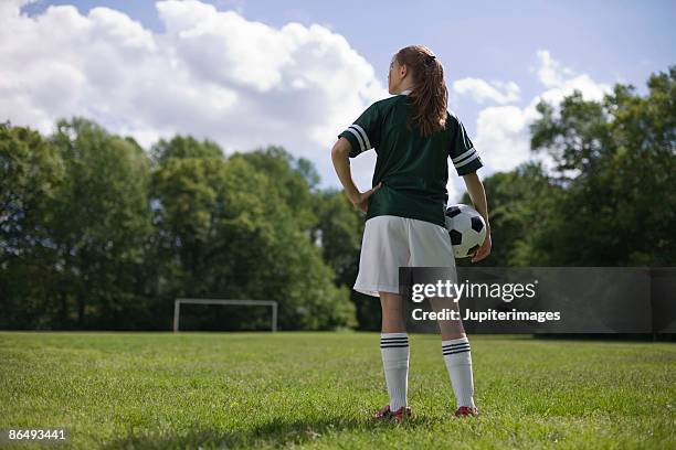 back view of girl with soccer ball - soccer back stock-fotos und bilder