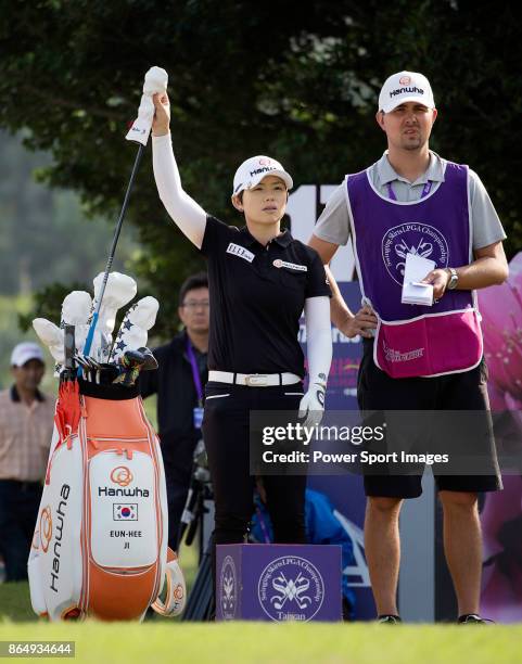 Eun-Hee Ji of South Korea pulls a club from her bag on the 17th tee during the Swinging Skirts LPGA Taiwan Championship on October 22, 2017 in...