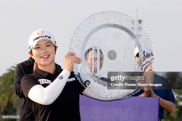 Eun-Hee Ji of South Korea poses for a photo while holding the trophy on the 18th green after winning the Swinging Skirts LPGA Taiwan Championship on...