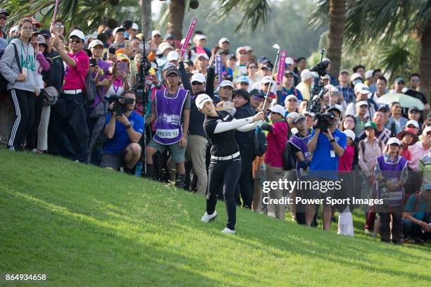 Eun-Hee Ji of South Korea hits a shot out of the rough on the 18th hole during the Swinging Skirts LPGA Taiwan Championship on October 22, 2017 in...