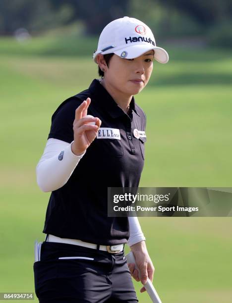 Eun-Hee Ji of South Korea acknowledges the crowd on the 16th green during the Swinging Skirts LPGA Taiwan Championship on October 22, 2017 in Taipei,...