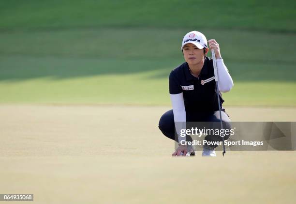 Eun-Hee Ji of South Korea lines up a putt on the 16th green during the Swinging Skirts LPGA Taiwan Championship on October 22, 2017 in Taipei, Taiwan.